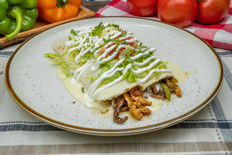 Burrito California topped with cheese sauce