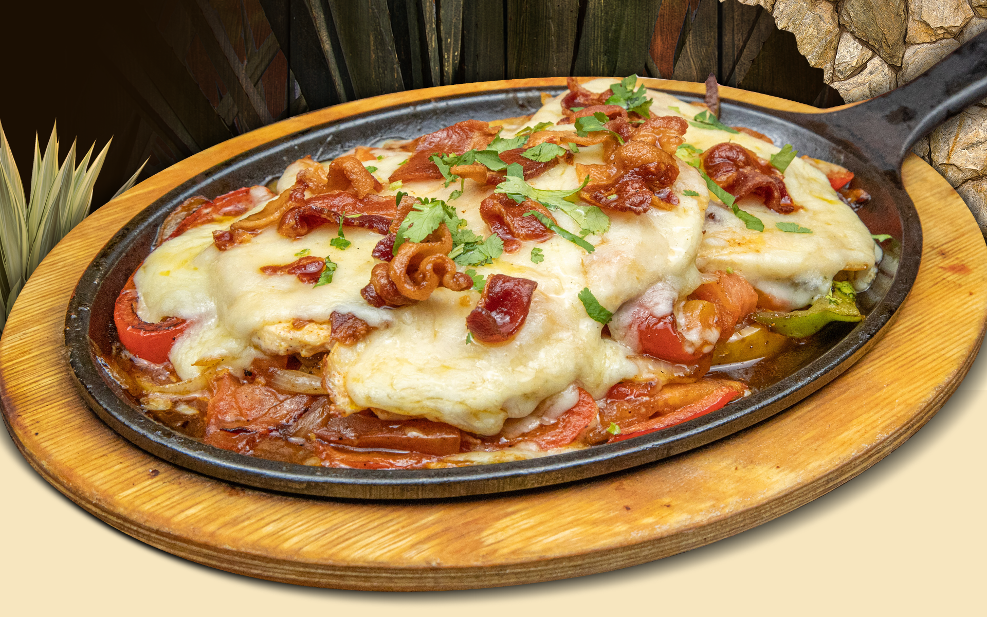 Sizzling chicken fajitas with melted cheese, bacon, and vegetables
